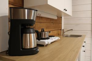 a coffee maker sitting on top of a kitchen counter at Villa Orohat 2 in Rovaniemi