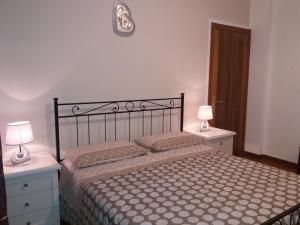 A bed or beds in a room at Casa Vacanze "Ai piedi di Assisi"