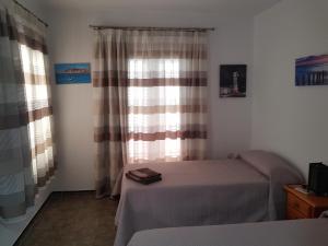 Ένα ή περισσότερα κρεβάτια σε δωμάτιο στο Villa PaloMayor