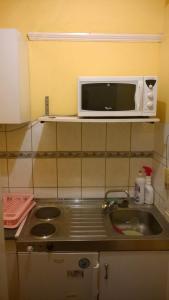 Kuchyňa alebo kuchynka v ubytovaní White Ship Apartman
