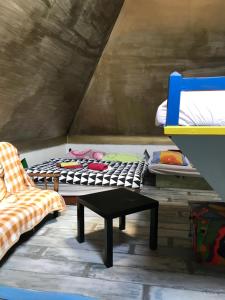 a room with a bed and a table and a chair at Sebarozvojove centrum vedy a umenia s ubytovanim in Bratislava