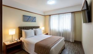 Cama o camas de una habitación en La Residence Itaim by Manager