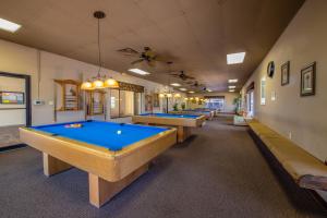 a row of pool tables in a room at Buttonwood Bay in Sebring