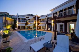 a courtyard with a swimming pool in a building at Altanahouse in Parga