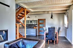 a living room with a couch and a table at Holiday House Sabala 2 in Stará Lesná