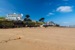 an orange ball in the sand on a beach at Burgh Island Hotel in Bigbury on Sea