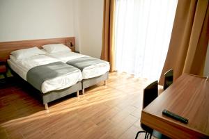 Una cama o camas en una habitación de Simar