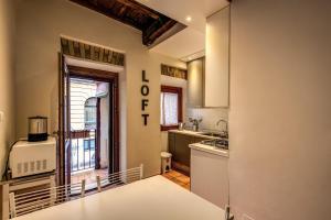 a kitchen with a sink and a stove at Magenta Collection Moro in Rome