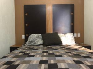 Postel nebo postele na pokoji v ubytování Hotel del Carmen
