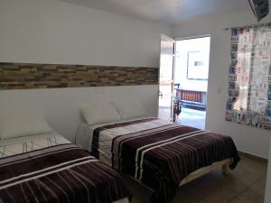 Katil atau katil-katil dalam bilik di Hostal Maple