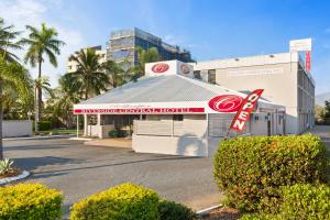 a red and white food truck parked in front of a building at Rockhampton Riverside Central Hotel in Rockhampton