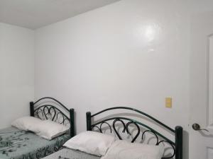 Katil atau katil-katil dalam bilik di Hostal Maple