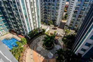 an overhead view of a courtyard in a city with tall buildings at Norico's Condo in Manila