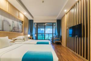En eller flere senger på et rom på Yangshuo Zen Garden Resort
