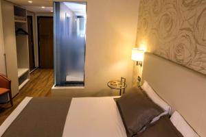 Posteľ alebo postele v izbe v ubytovaní Best Western Hotel City