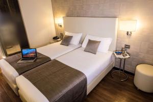 Posteľ alebo postele v izbe v ubytovaní Best Western Hotel City
