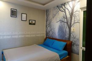 Giường trong phòng chung tại DaLat Sky Hostel