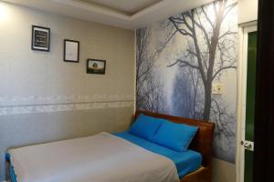 Postel nebo postele na pokoji v ubytování DaLat Sky Hostel
