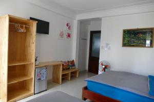 Postel nebo postele na pokoji v ubytování DaLat Sky Hostel