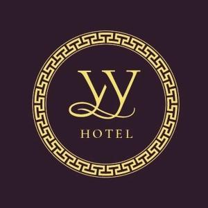 a gold luxury hotel logo on a dark background at Hotel Ulan-Ude in Ulan-Ude