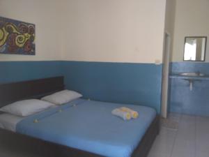 Postel nebo postele na pokoji v ubytování Syifa Homestay