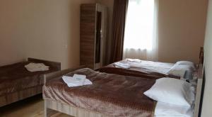 Voodi või voodid majutusasutuse Guesthouse Guram Baba toas