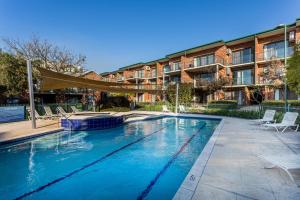 a swimming pool in front of a building at Perth Ascot Central Apartment Hotel Official in Perth +48 photos