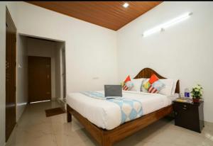 Postel nebo postele na pokoji v ubytování Munnar Minds Homestay