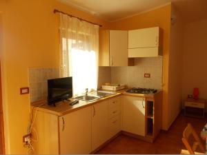 Кухня или мини-кухня в Agriturismo Ezzi Mannu
