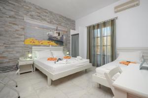 Postel nebo postele na pokoji v ubytování Dimitra Hotel