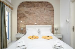 Postel nebo postele na pokoji v ubytování Dimitra Hotel