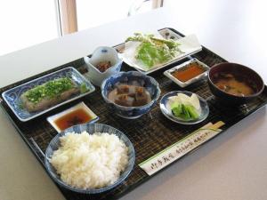 a tray with different types of food on a table at 森林公園スイス村 青少年 山の家 in Kyotango
