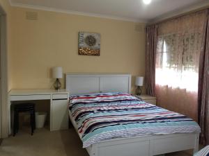 Postel nebo postele na pokoji v ubytování ADA Homestay