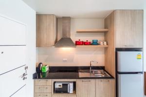 Cuisine ou kitchenette dans l'établissement Apartments at The Bliss Condo by Lofty