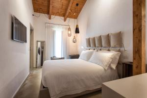 Postel nebo postele na pokoji v ubytování Terra di Gradara
