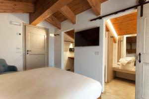 Postel nebo postele na pokoji v ubytování Terra di Gradara