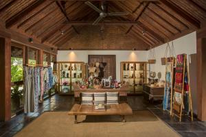a room with a table and chairs in it at Jeeva Klui Resort in Senggigi