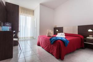 Posteľ alebo postele v izbe v ubytovaní Hotel Stacchini