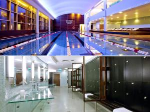 a large swimming pool in a building at Chopin Apartments - Platinum Towers in Warsaw