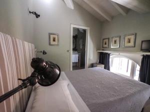 Postel nebo postele na pokoji v ubytování Corte Merighi Charming Rooms