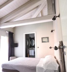 Postel nebo postele na pokoji v ubytování Corte Merighi Charming Rooms