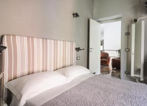 Postel nebo postele na pokoji v ubytování Corte Merighi Charming Rooms
