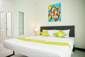 Sabai Place Donmueang Airport tesisinde bir odada yatak veya yataklar