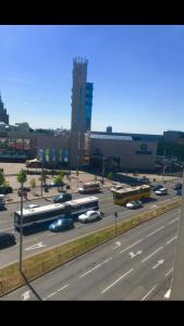 a highway with buses and cars in a parking lot at BalticApart Riga in Rīga