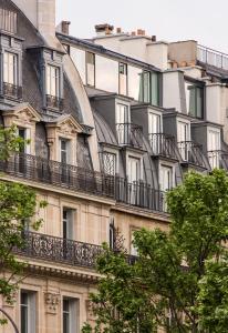 a building with balconies on the side of it at Opera Lieu Unique in Paris