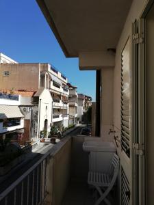 a balcony with a sink and a view of a street at Akron B&B in SantʼAlessio Siculo