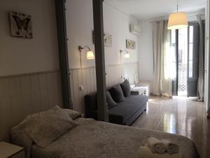 Posteľ alebo postele v izbe v ubytovaní Hostal Dragonflybcn