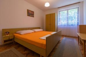 Postel nebo postele na pokoji v ubytování APARTMAN VERA