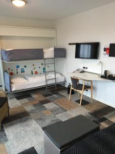 Postel nebo postele na pokoji v ubytování Hotel Skivehus