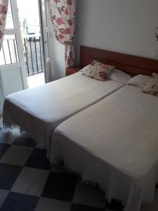 Posteľ alebo postele v izbe v ubytovaní Hostal Centro Sol